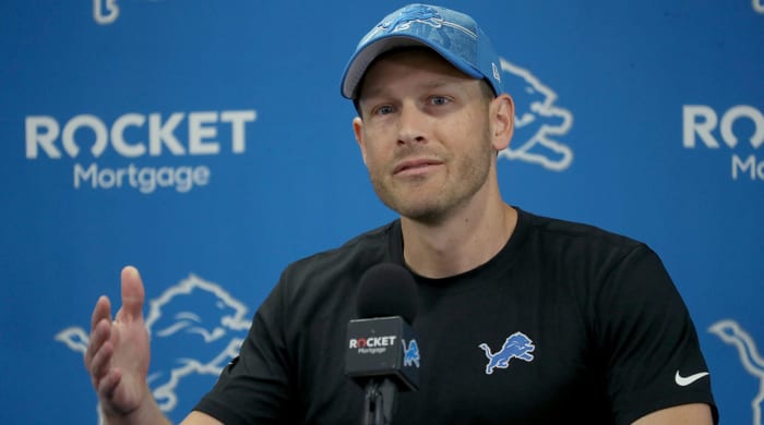 Lions offensive coordinator Ben Johnson talks with reporters before training camp.